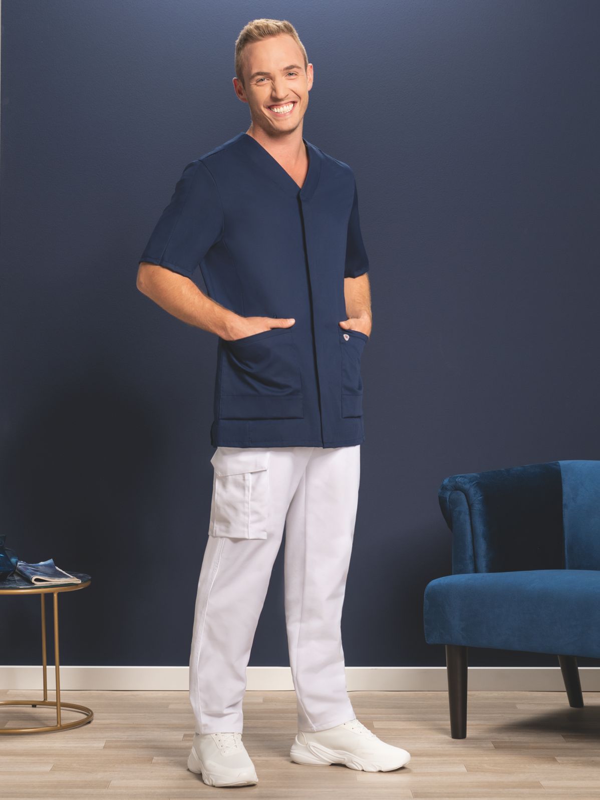 A man wears a BP® tunic in midnight blue.